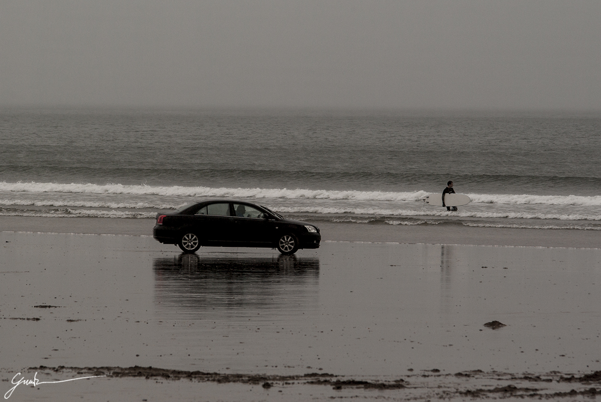 Surfing and driving at Inch Beach